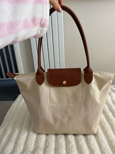 Longchamp cream with slight - cream,