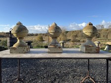 Set of three ornate terracotta ball  pier caps