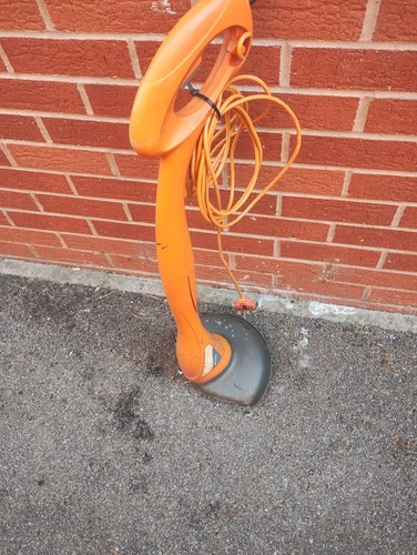 Electric grass strimmer used