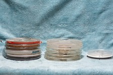 ASSORTED REEL TO REEL TAPE SPOOLS AND EMPTY SPOOLS.