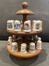 Wooden Display Stand with vintage brands on the thimbles