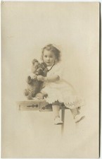 CHILD WITH TEDDY BEAR -