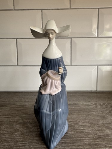 Retired lladro time sew nun - lladro,