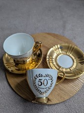 A pair of Vintage Royal Winton Grimwades 50th Anniversary Gold Cups & Saucers