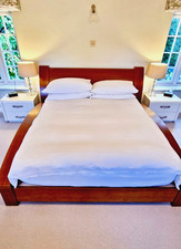 Designer double bed by Tom Schneider in cherrywood