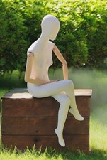 sitting female mannequin with