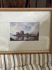The Framed Print of Eilean Donan Castle by The Scottish Artist William Dobbie..