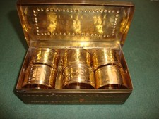6 Brass Napkin Rings in Brass hinged Box