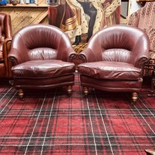 pair of leather arm chairs