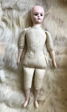 20th century  cloth bodied doll with porcelain head and limbs - stamped to neck