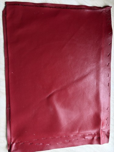 Red waxy leather piece approx