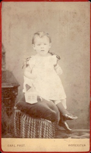 Young child sitting stool earl - young,