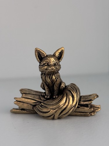 Small brass fox sat a - brass,