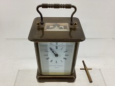 MATTHEW NORMAN LONDON BRASS CARRIAGE CLOCK WITH KEY.