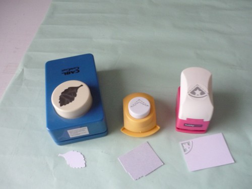 Three paper punches two corner - punches,