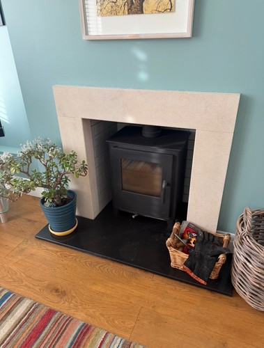 Cream stone fireplace surround
