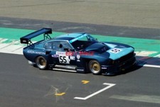 PHOTO  DAVID BEATTY POWERS HIS EX-GERRY MARSHALL 7.0 LITRE MARSH PLANT ASTON MAR