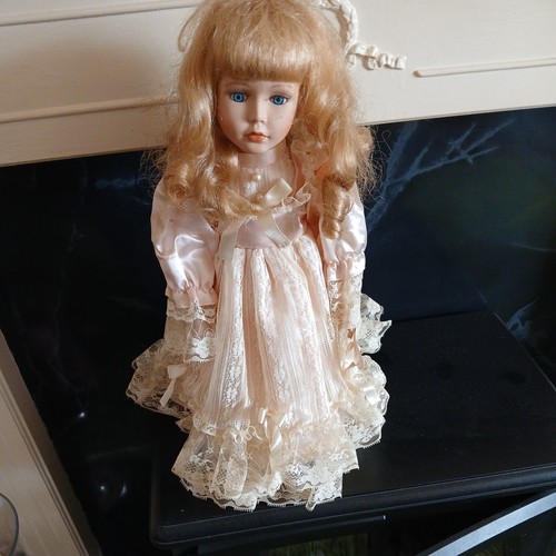 Porcelain doll with - with, pink