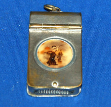 An antique lady golfer vesta