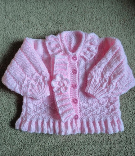 Hand knitted baby - cardigan, and