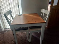 table and 2  chairs white logged wooden  top sturdy and strong 