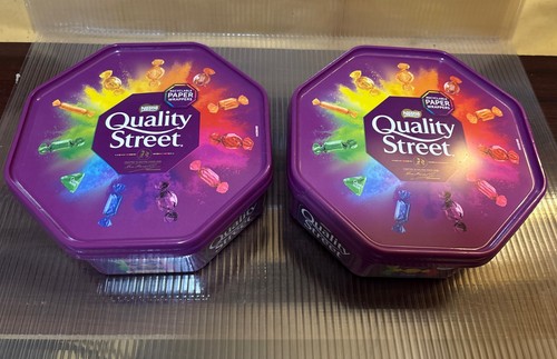 Two empty quality street - quality,