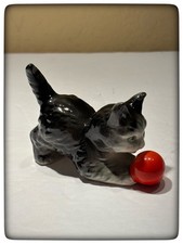 “Cat Playing With Red