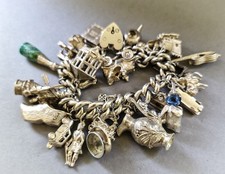 Vintage heavy silver charm bracelet packed with charms 141g