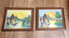 a pair of framed oil paintings