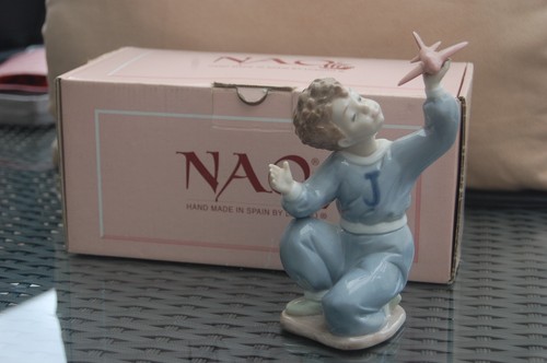 Nao figurine boy kneeling - boy, with