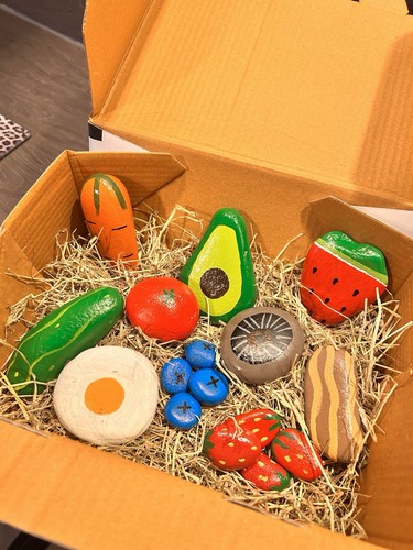 Hand painted pebbles - hand, stones