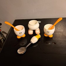 assorted  egg cups and spoons 