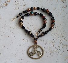 Gold Trisk pendant with Obsidian and Onyx