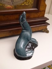 poole pottery england,seal,glossy finish perfect condition,seal on black rock