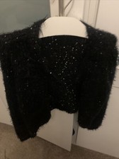 Girls age 8 to 9 black with silver seqin party jumper