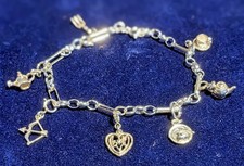 A sterling silver charm bracelet made in England