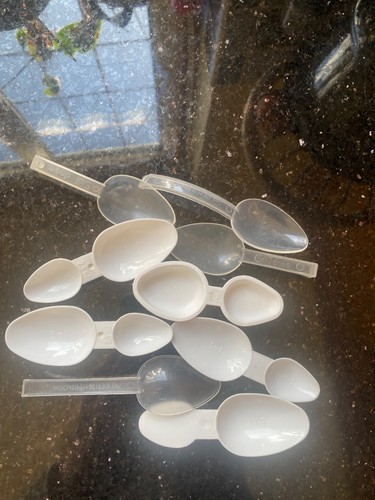 Job lot medicine spoons - of,