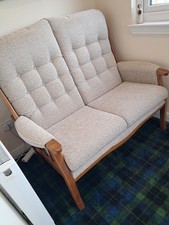 small 2 seater couch cream colour, solid wooden frame. Suitable for conservatory