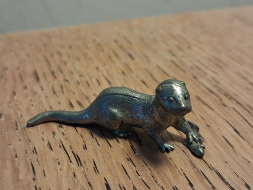 Small pewter otter and - and, fish