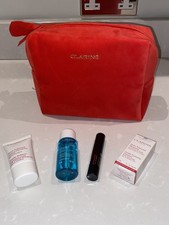 CLARINS MAKE UP BAG & MASCARA CLEANSER & SKIN CARE PRODUCTS WITH 4 ITEMS NEW