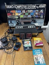 Atari 2600 With 2 joy sticks 2 paddles and 2 Games In Original Box