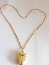 GOLD TONED  LADY BIRD  PENDANT WATCH AND CHAIN WORKING QUARTZ BY CARVEL