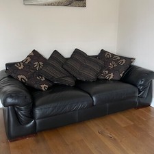 Large 3 seater  Black leather sofa, 2 Arm chairs and footstool