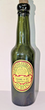 ENNISKILEN, KEANE & CO. RARE LABELLED GUINNESS BOTTLE. c1921.   9 inches tall.