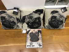 Three Pug cushions and a