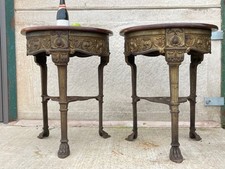 A FINE PAIR OF ANTIQUE ART NOUVEAU CAST IRON PUB SIDE TABLES