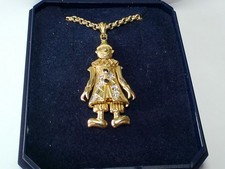 A DIAMOND/SAPPHIRE ARTICULATED 9CT GOLD CLOWN PENDANT ON A 50CM CHAIN 6.83grms