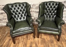 His & hers leather chesterfield Queen Anne high back chairs in Antique Green