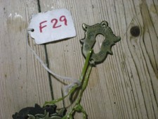 ANTIQUE BRASS ESCUTCHEON