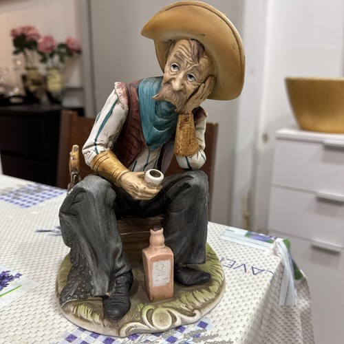 Cowboy having drink figurine - cowboy,